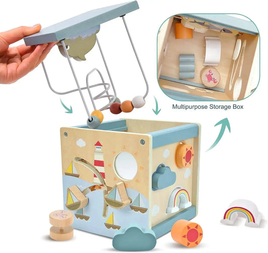 Infant shape sorter cube with storage box feature