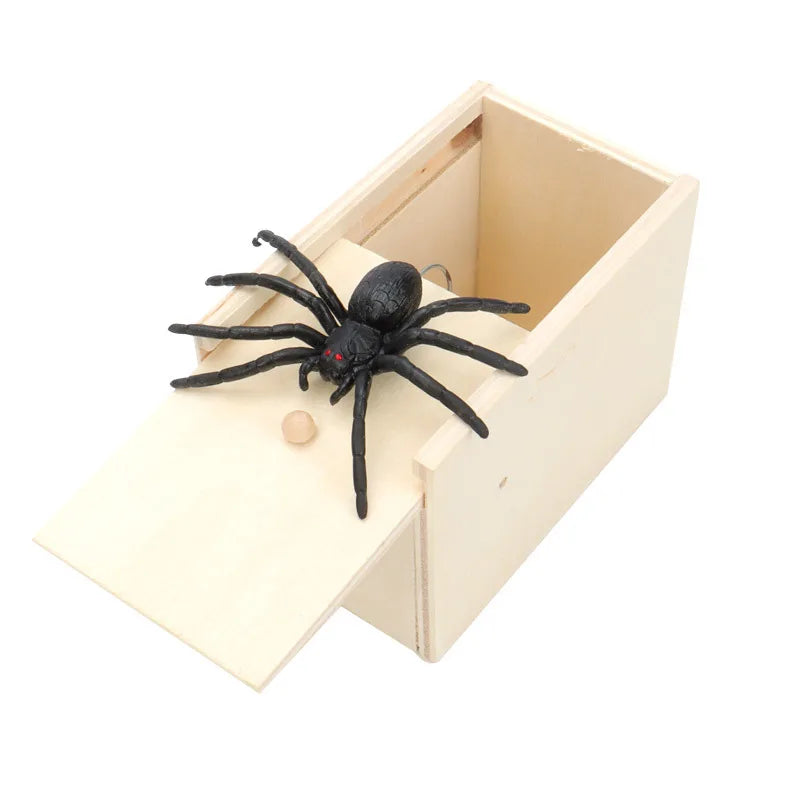 Wooden prank box with a realistic black spider on the lid, showcasing a fun and surprising gift for prank lovers.