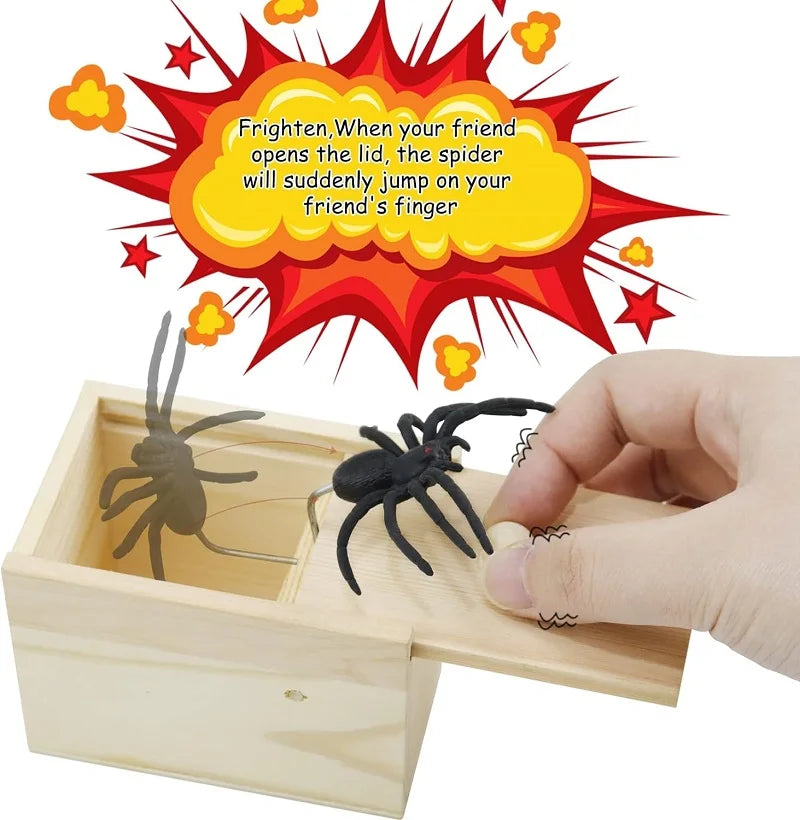 Wooden prank box with a black spider springing out as the lid is opened, accompanied by a comic-style explosion graphic. Ideal for pranks and laughter.