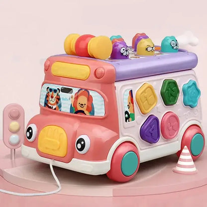 Pink musical bus toy with shape sorter and pull string